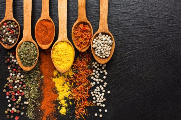 top-view-spoons-with-spices-powder-and-spread-besides-3
